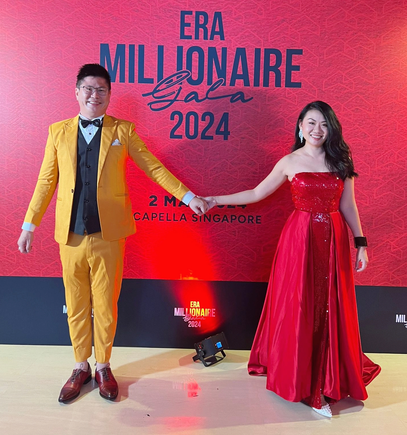 ERA Millionaire Gala 2024 backdrop with Christopher and partner