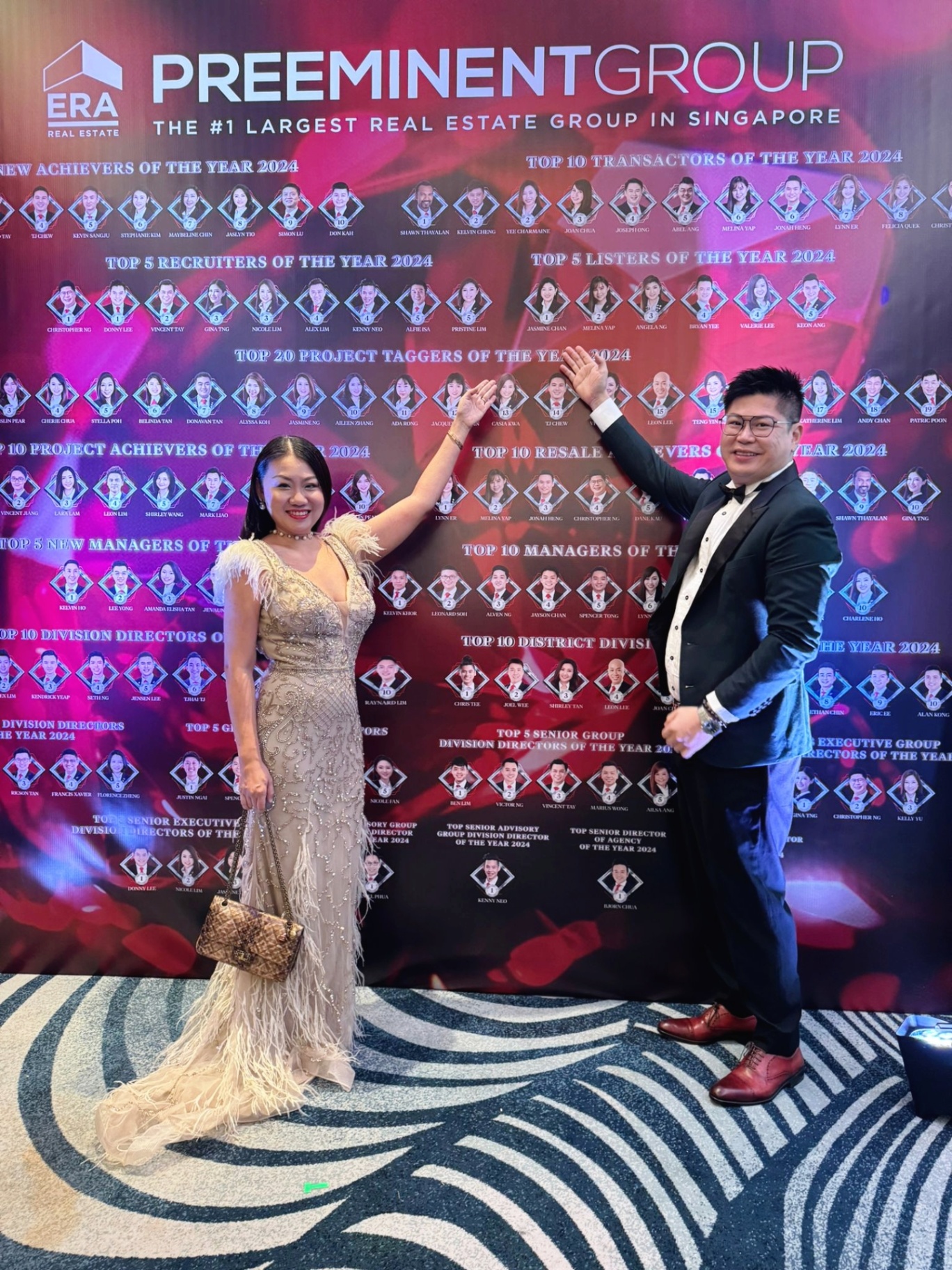 Christopher and Jasmine at ERA Preeminent Group leaderboard wall
